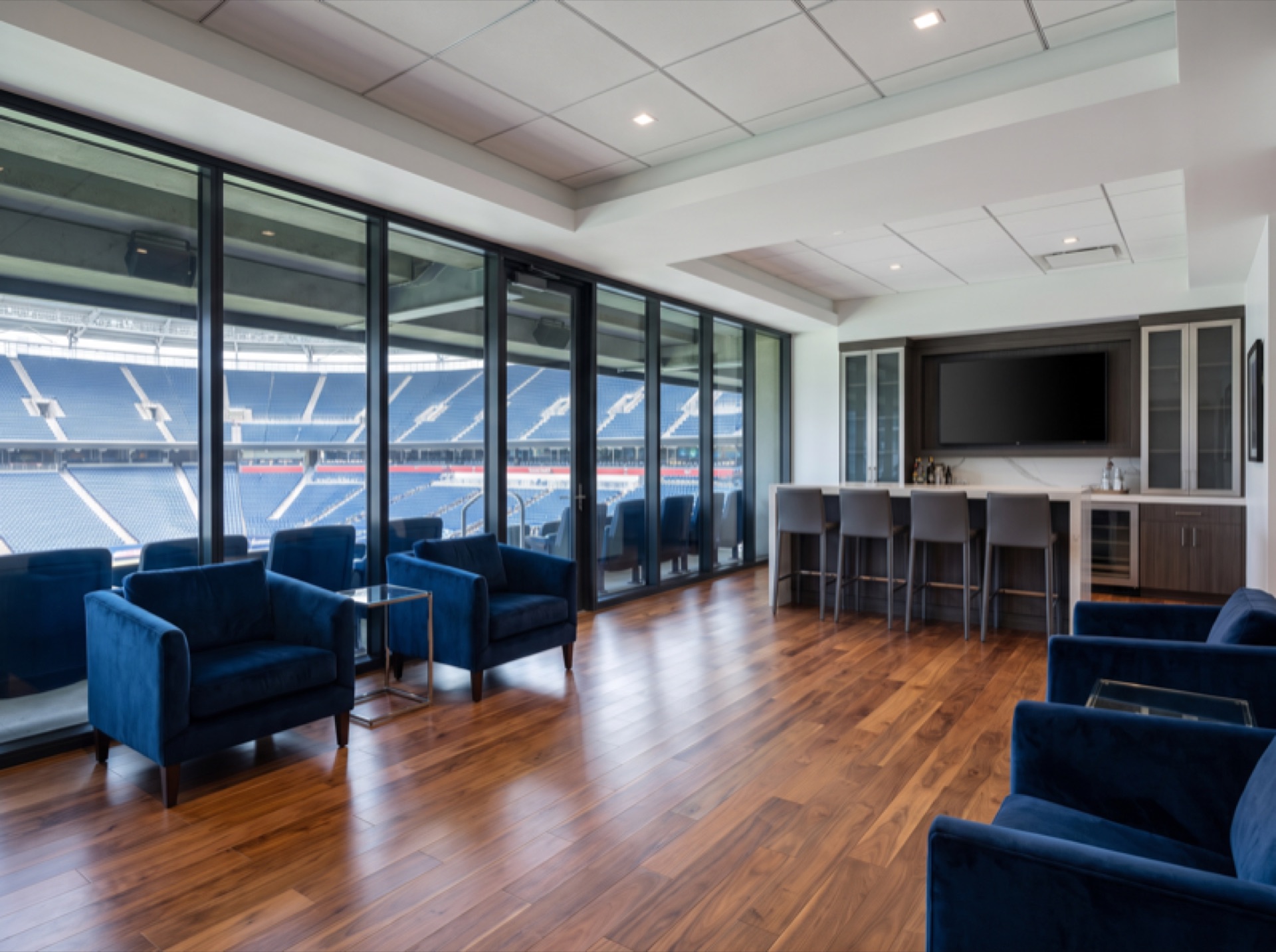 Arena luxury suite interior with UV protection window film preserving upholstery and flooring