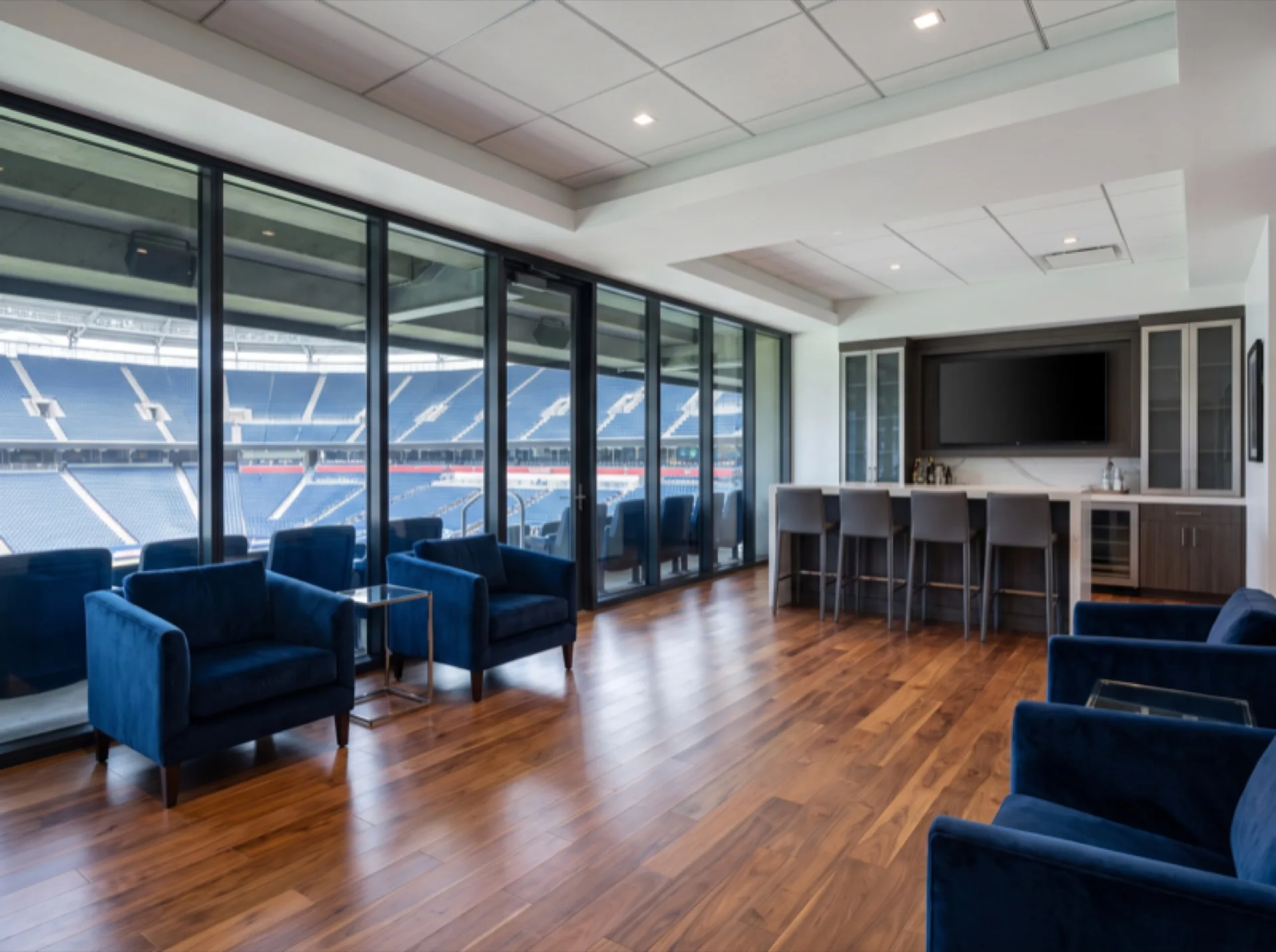 Arena luxury suite interior with UV protection window film preserving upholstery and flooring