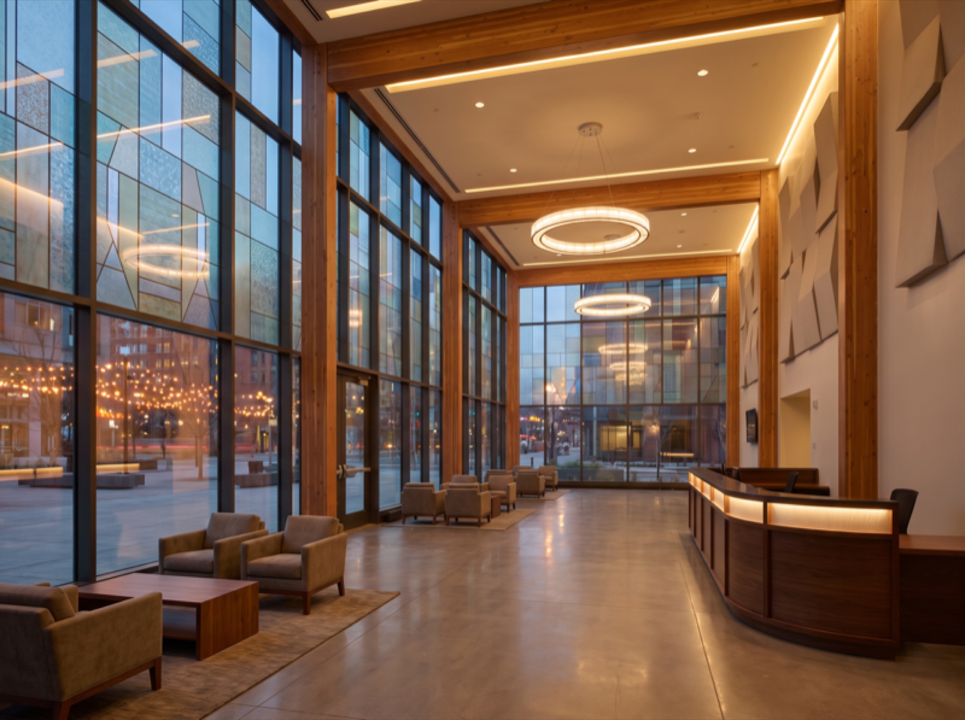 Modern concert venue lobby with tall glass windows treated with decorative and solar control window film