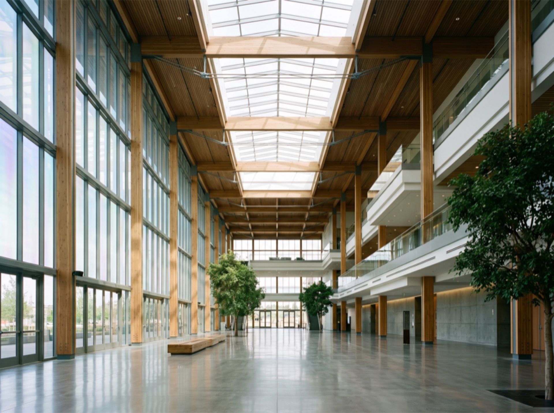 Convention center grand atrium with massive skylight and glass walls with energy-efficient window film