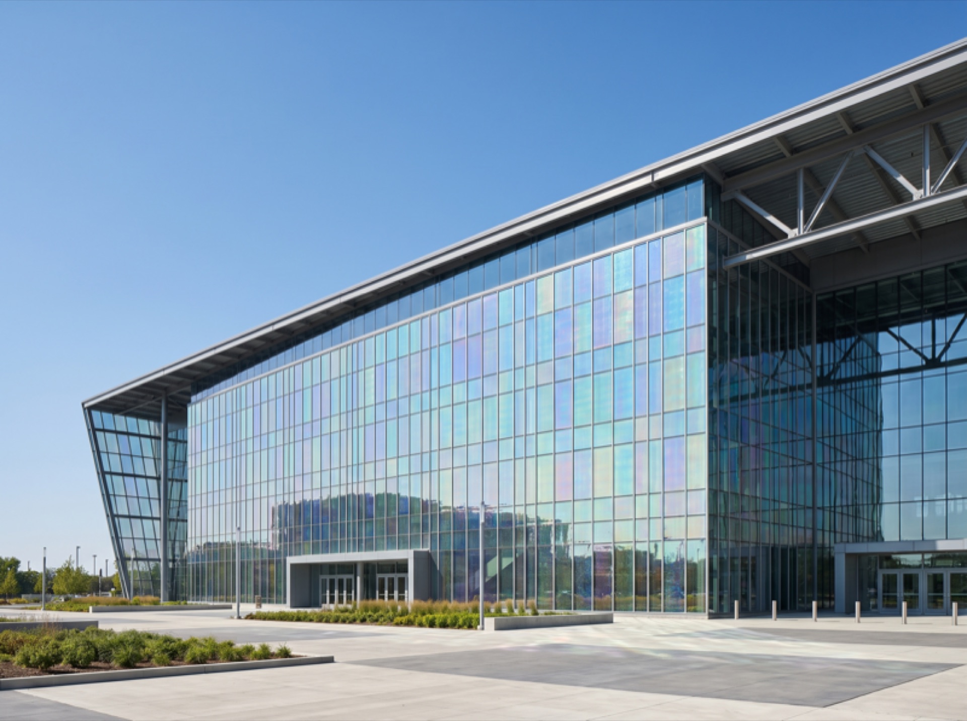 Large arena exterior glass facade with energy-saving window film — reflective curtain wall