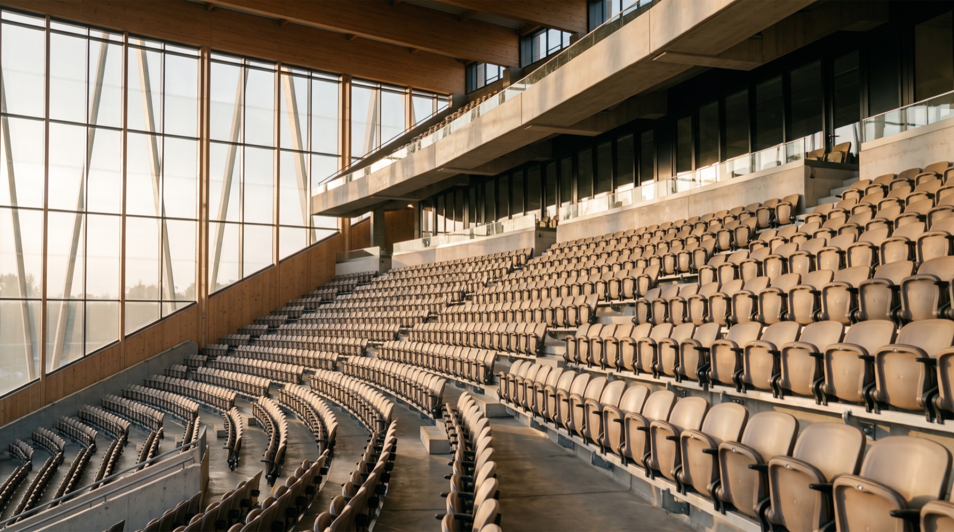 Stadium seating area with glare control window film on large glass windows