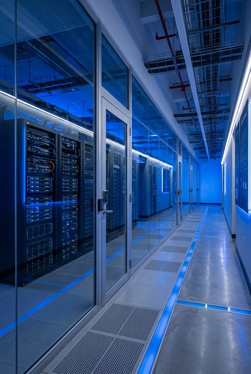 Modern data center interior with secured glass partitions and server racks — security window film for Philadelphia data centers