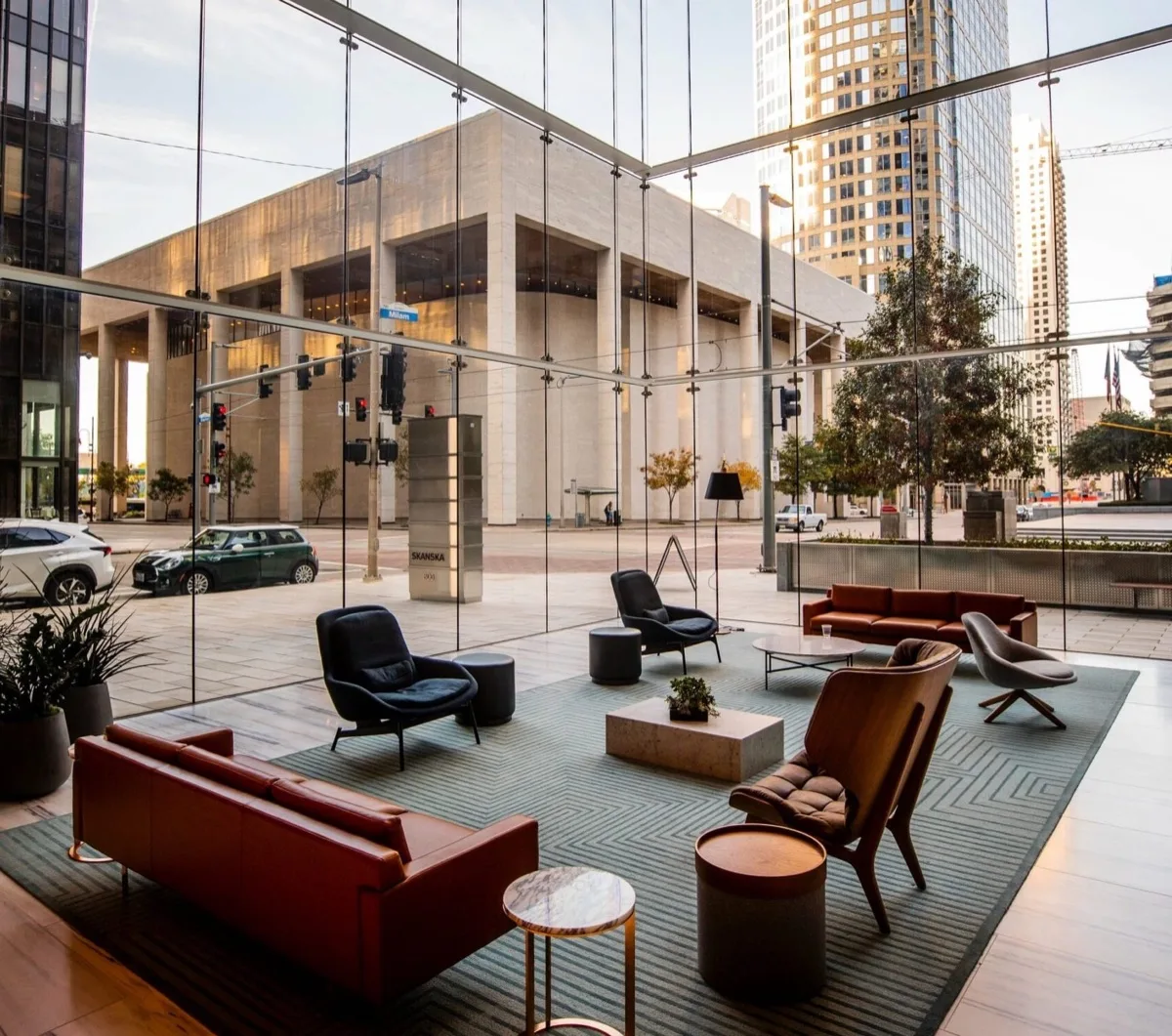 UV-blocking energy-saving window film in a Philadelphia corporate lobby with floor-to-ceiling glass, blocking 99% of UV rays while preserving the full city view