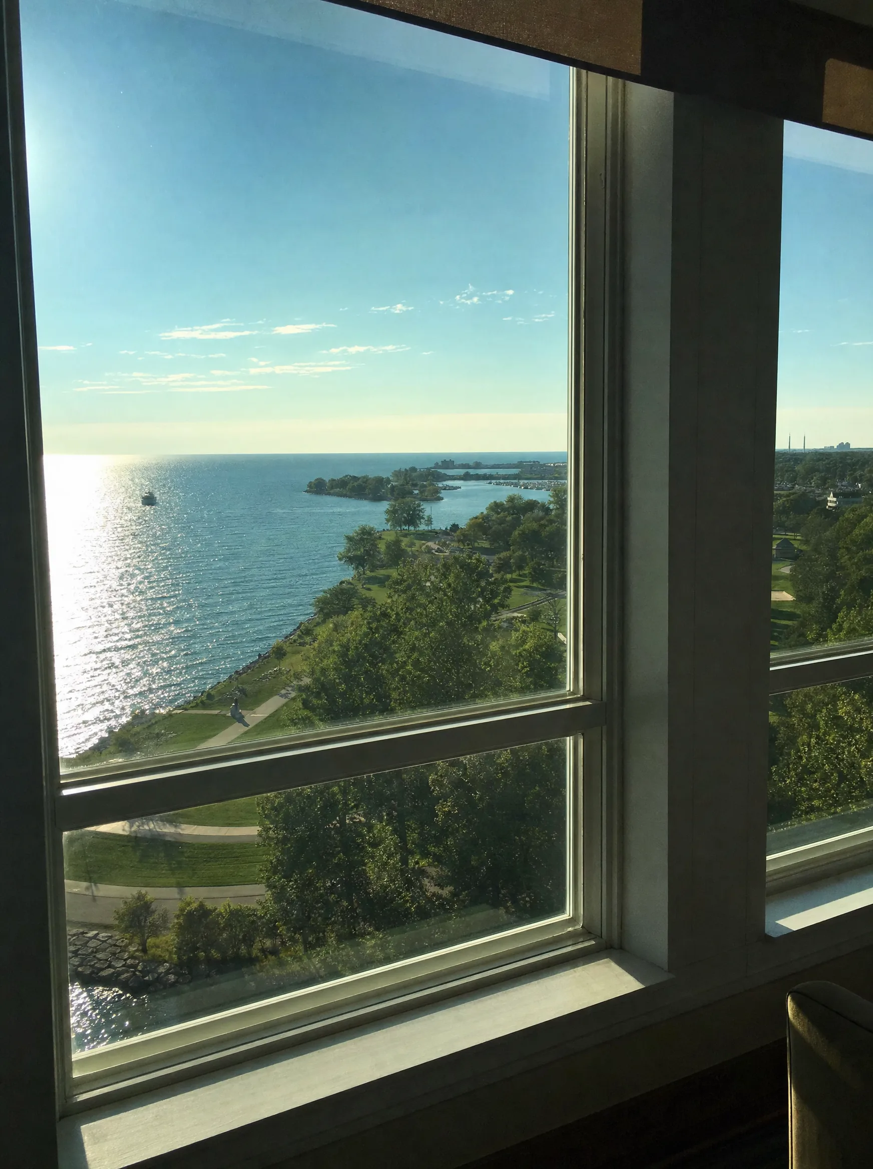 Erie skyline and neighborhoods along the Lake Erie bayfront — Erie's lake glare, summer sun, and snowy winters make window film essential